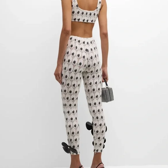 AREA eye crochet knit pants featuring crystal flower applique